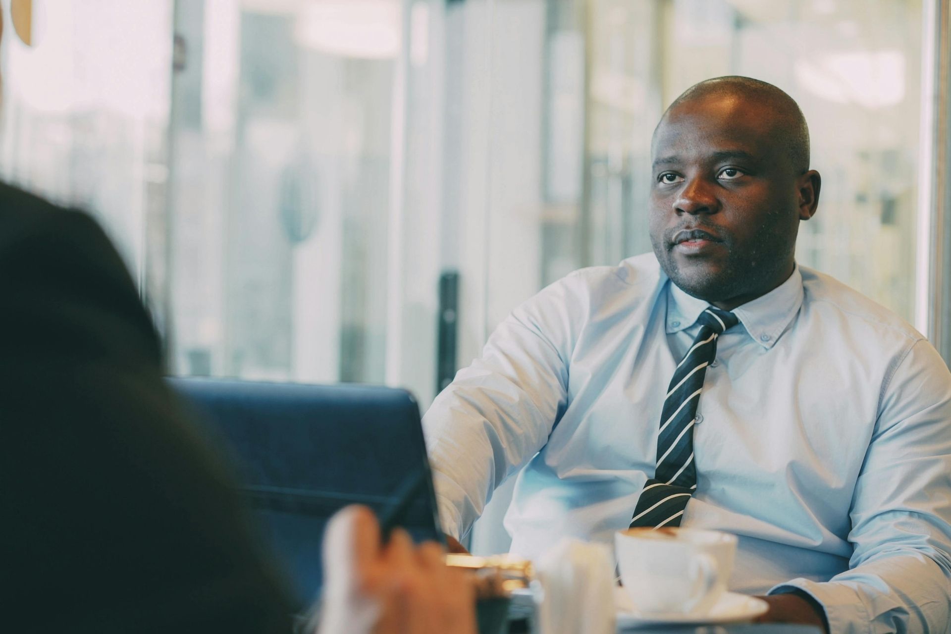 A business leader discussing operations with the Oraconnect team